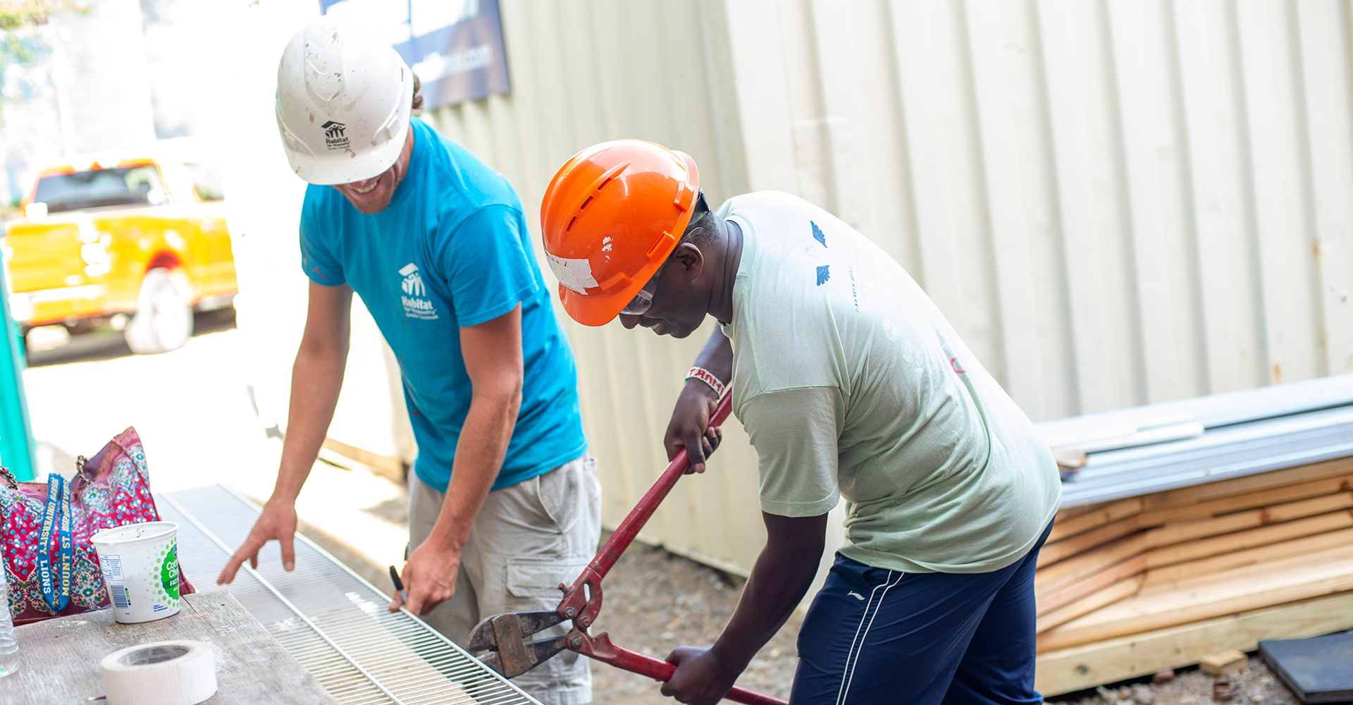 MSJ male students in construction hats cutting wood