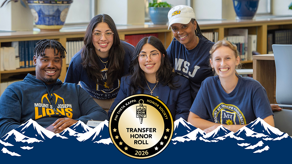 Mount St. Joseph students smiling next to each other in library