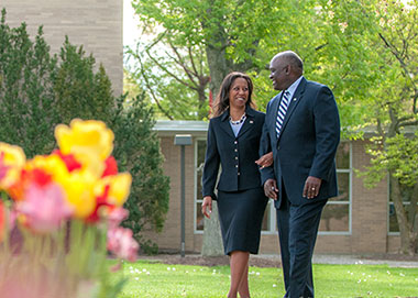 Dr. and Mrs. Williams walking outside