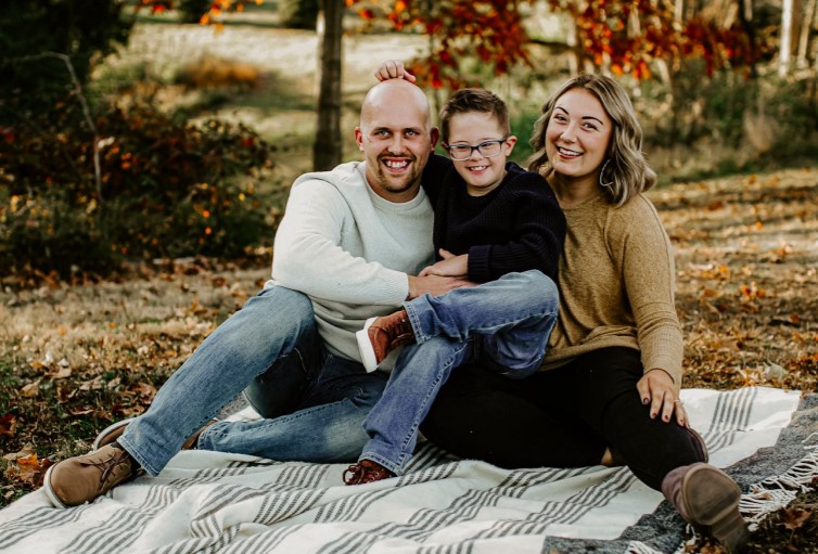 male student with his wife and child