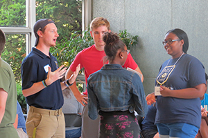 group of students standing together talking