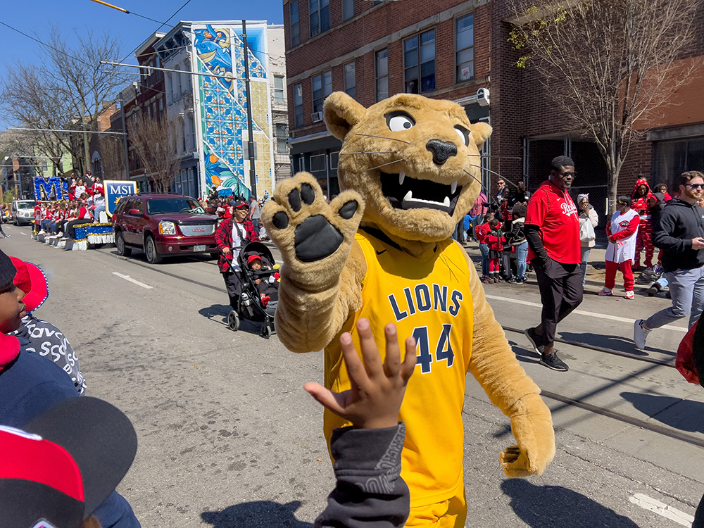 joe lion waving