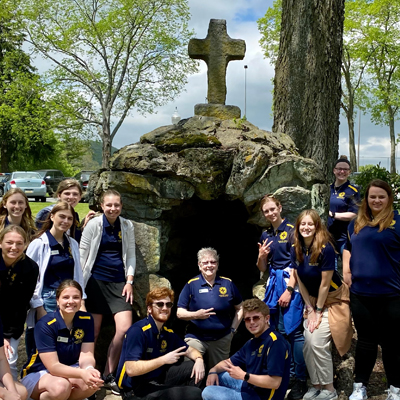 Mission Ambassador students gathered around a pilgrimage site