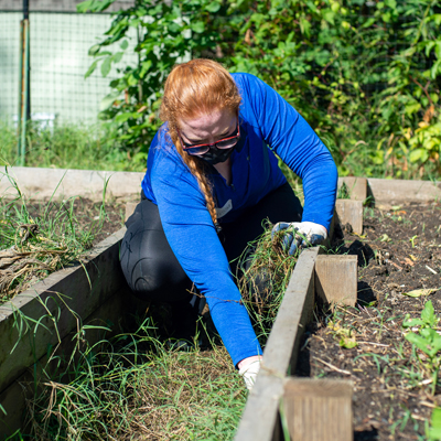 Female student working in a garden
