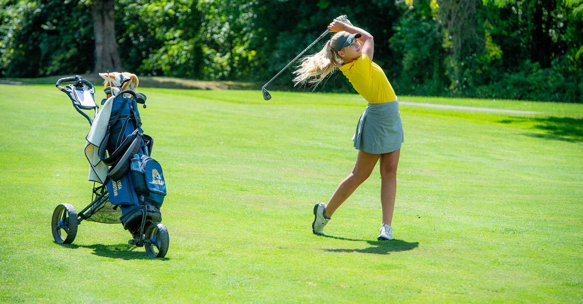 golf player hitting ball with golf club