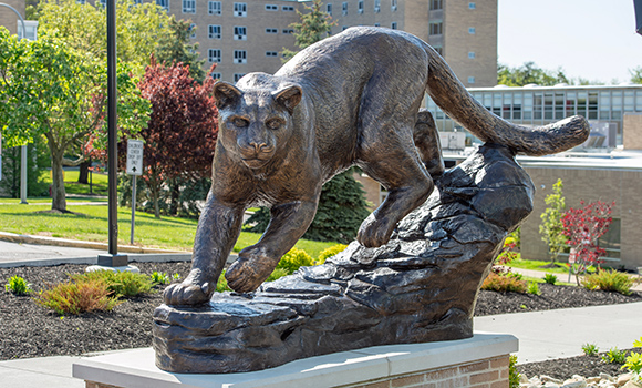 Catamount Lion Sculpture next to Centennial Field House at Mount St. Joseph University