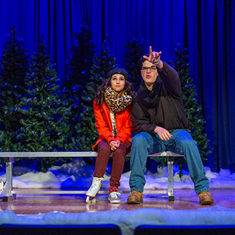 two MSJ theatre art students sitting next to each other on stage during winter production