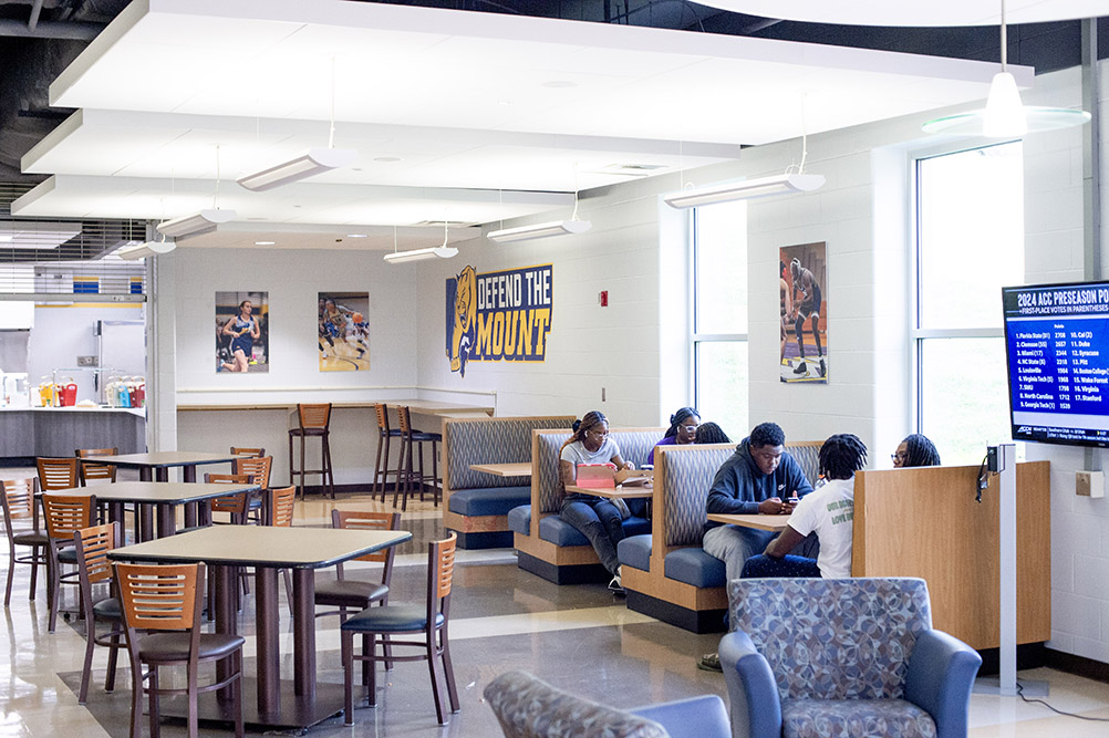 students sitting in a booth